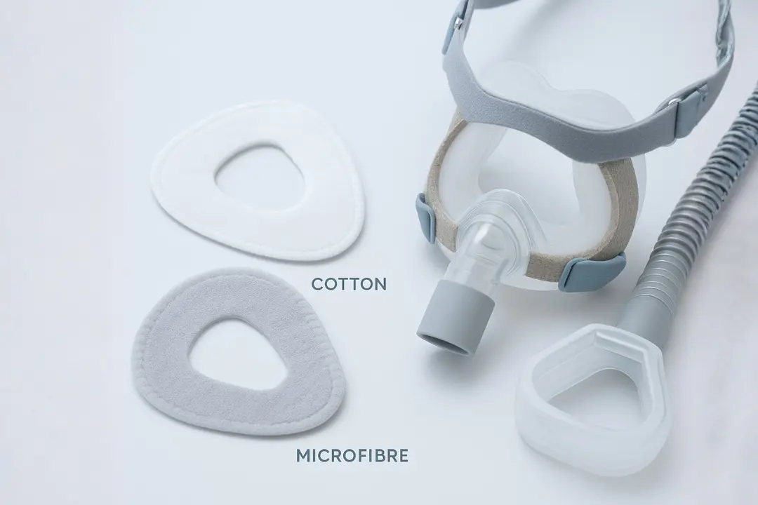 Soft CPAP mask liners made of cotton and microfibre beside nasal mask
