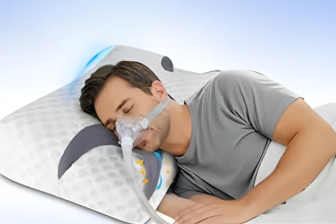 CPAP user sleeping with ergonomic anti-snoring pillow