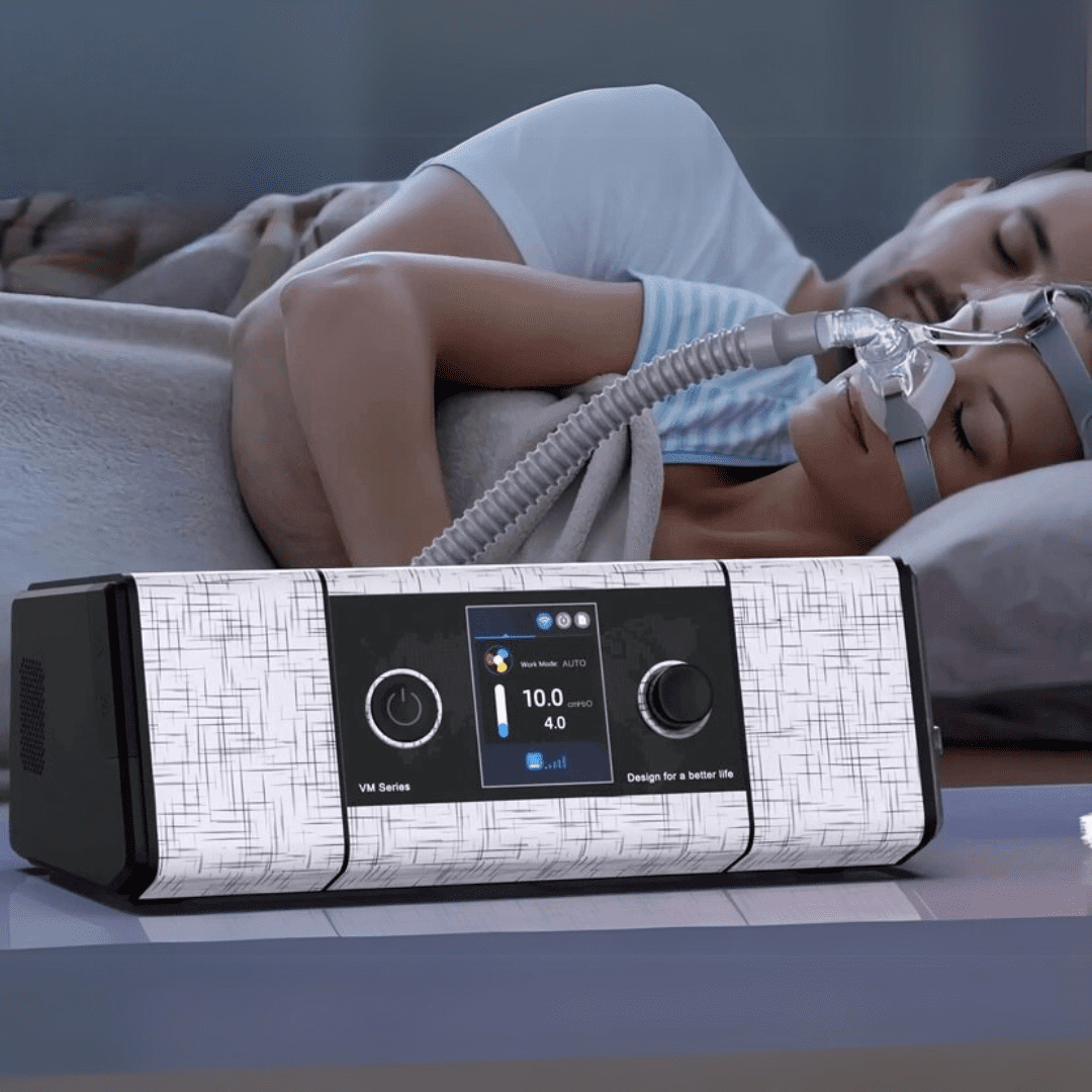 Modern bedroom setup showing CPAP machine beside bed – symbolizing restful sleep