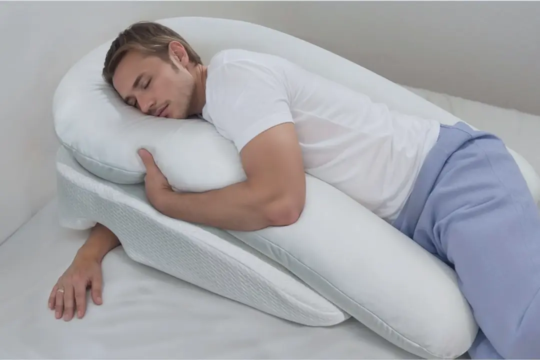Side-sleeper using an anti-snore pillow for sleep apnea relief