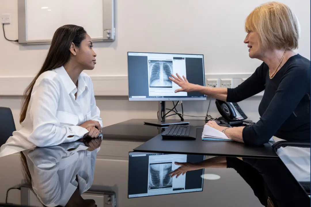 NHS prescription form beside modern CPAP machine and mask on table